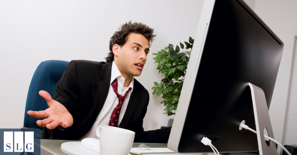Businessman reviewing information on a computer while responding to a legal demand letter.