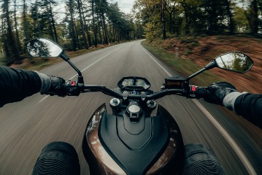 POV view shot of a motorcycle rider trying to avoid a motorcycle accident