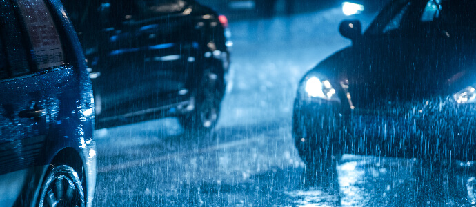 Cars driving on wet road in the rain with headlights, Bad Weather Accidents