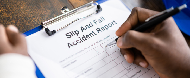 man signing a accident report
