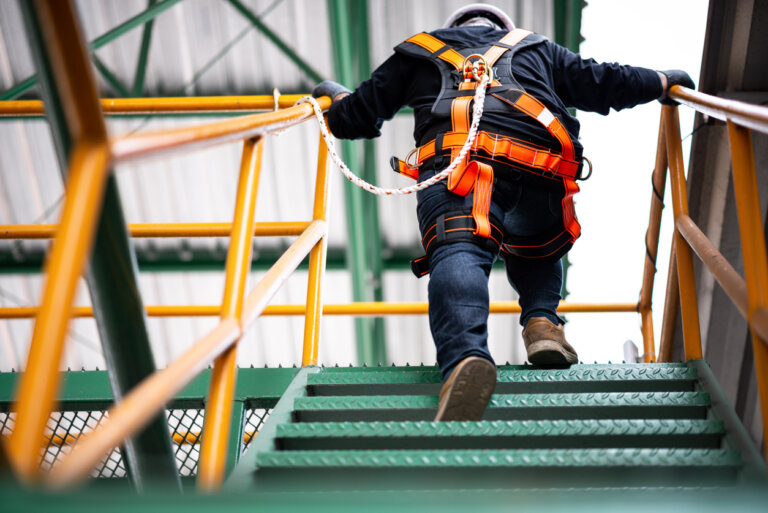 Construction worker climbing stairs