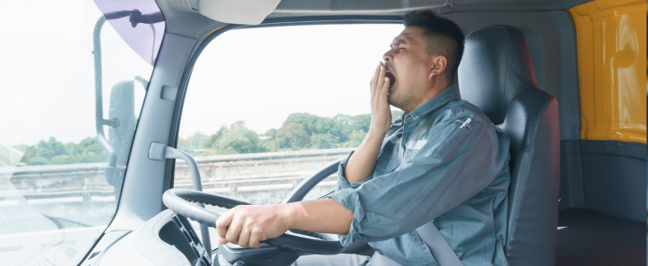 A fatigued driver driving a truck