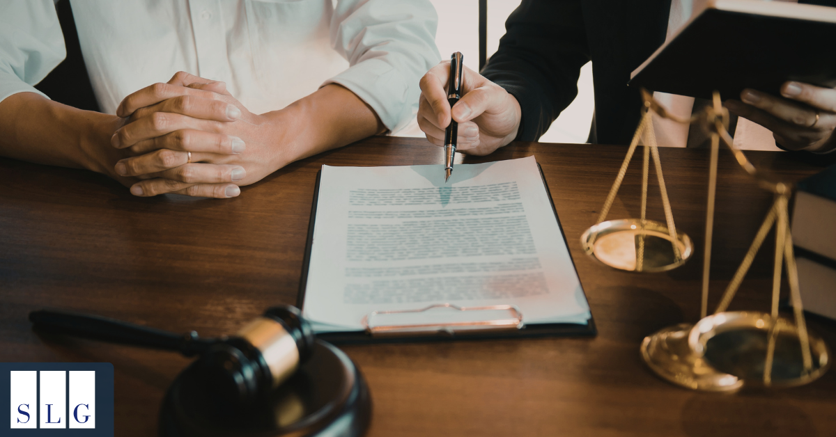 Attorney calculating wrongful death settlement damages with surviving family