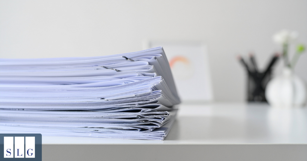 Person organizing medical bills and accident-related documents