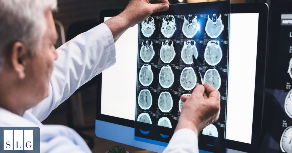 Doctor reviewing MRI or brain scan for a concussion patient