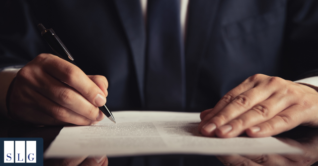 Attorney reviewing settlement and compensation documents for a brain injury claim
