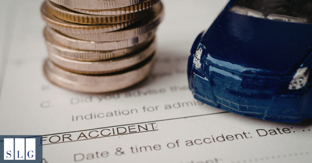 Insurance representative reviewing documents for a car accident settlement