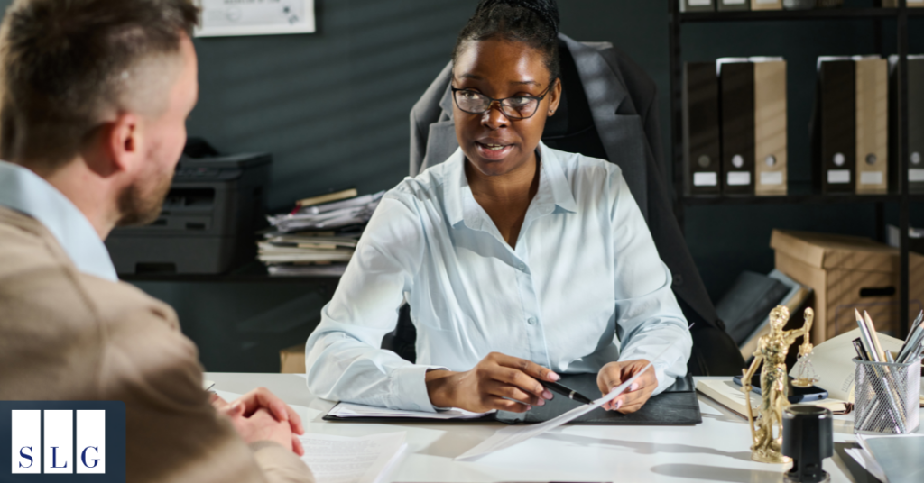 Personal injury attorney helping a car accident victim evaluate a settlement offer