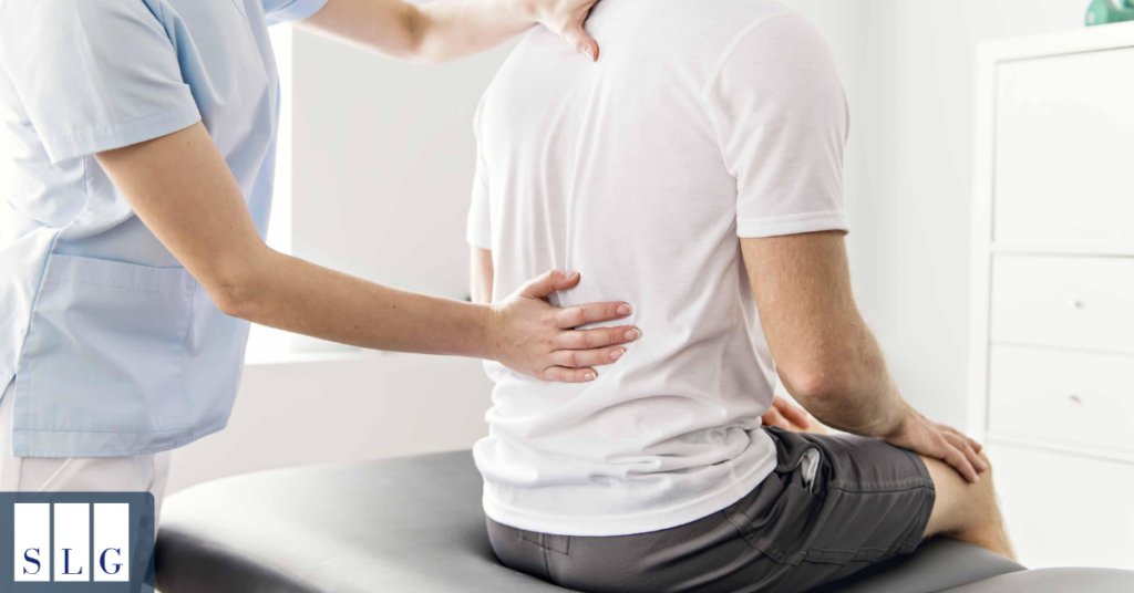 Doctor evaluating a patient with back and neck injuries after a car accident