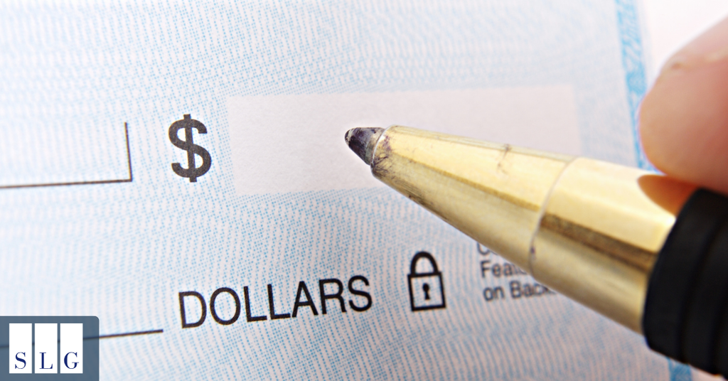 Close-up of a settlement check representing financial compensation from a motorcycle accident claim.